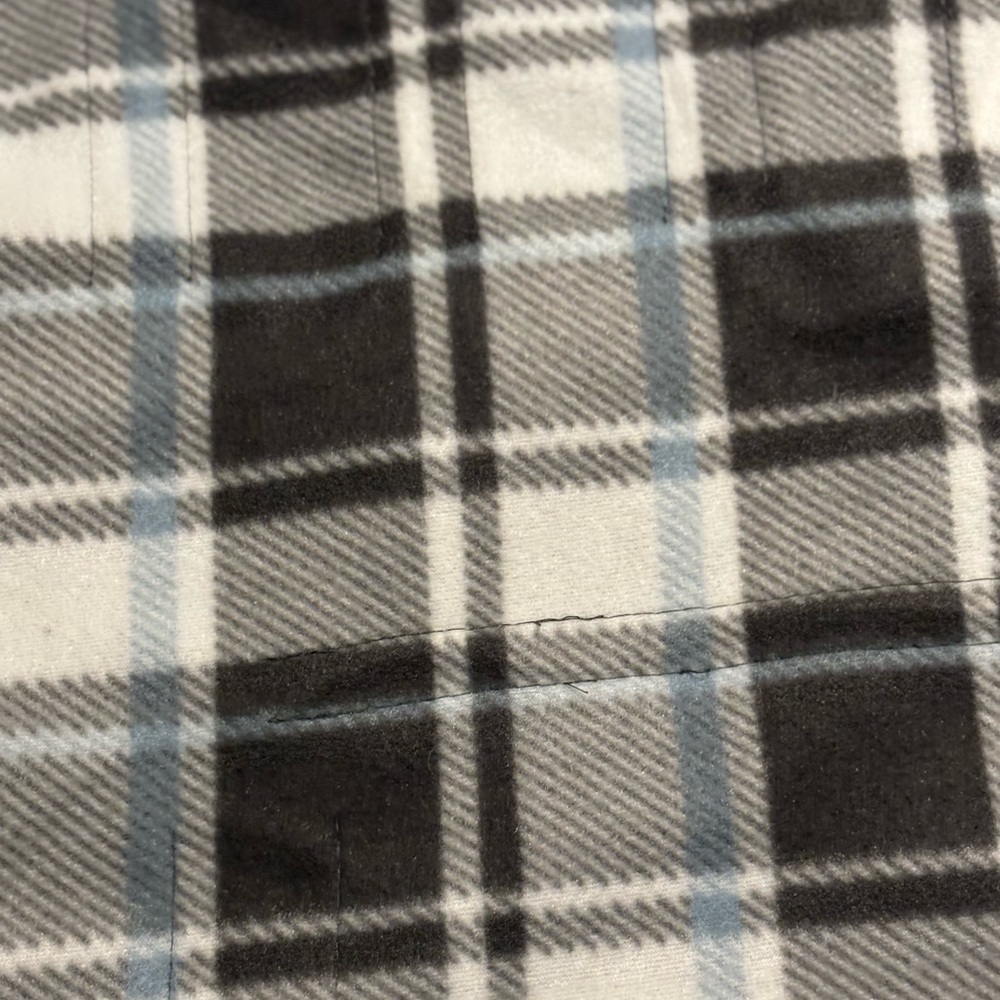 Sunbeam Heated Throw with Black and Gray Plaid and gray interior